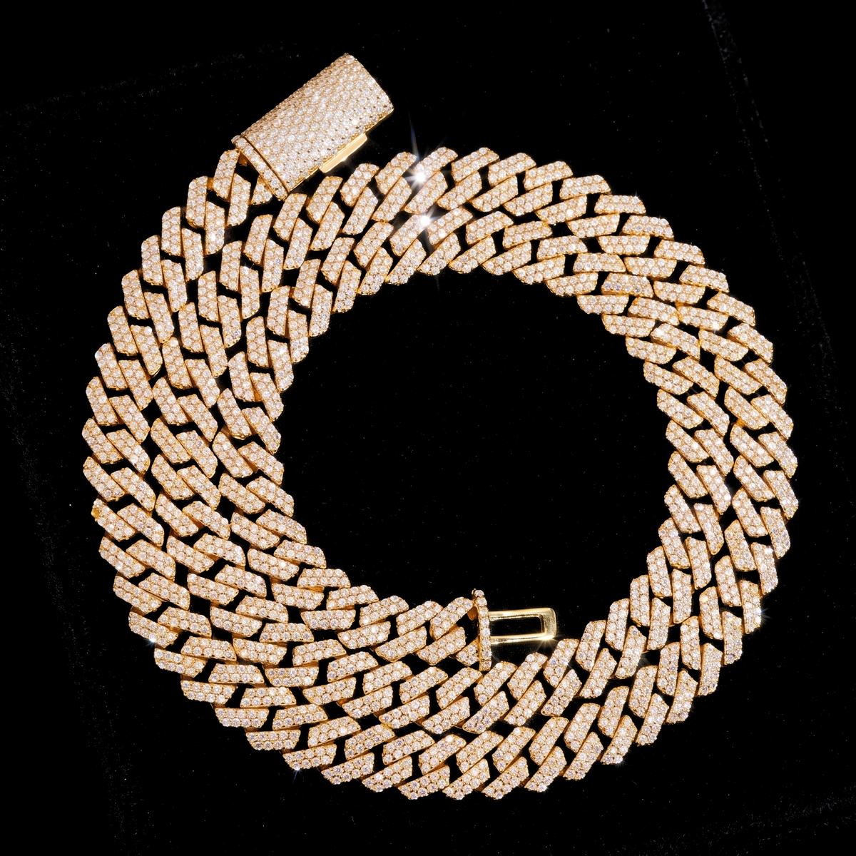 FROST LINE moissanite Cuban link chain in gold on black velvet
