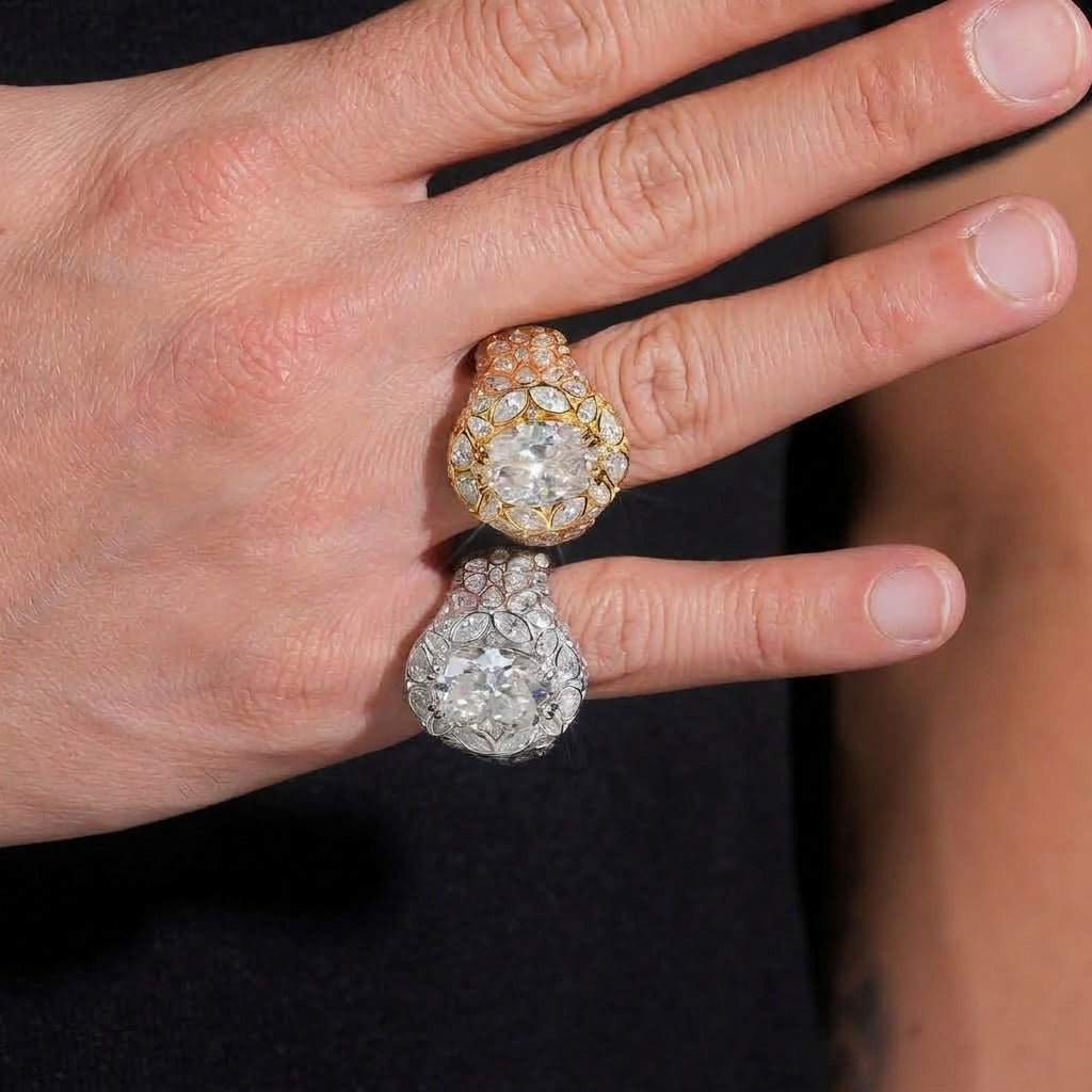 Hand wearing gold and silver FULL BLOOM oval moissanite statement rings