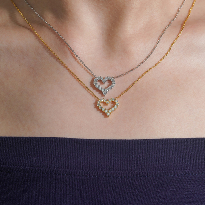 Moissanite heart necklace in gold and silver worn on model, 18 inch