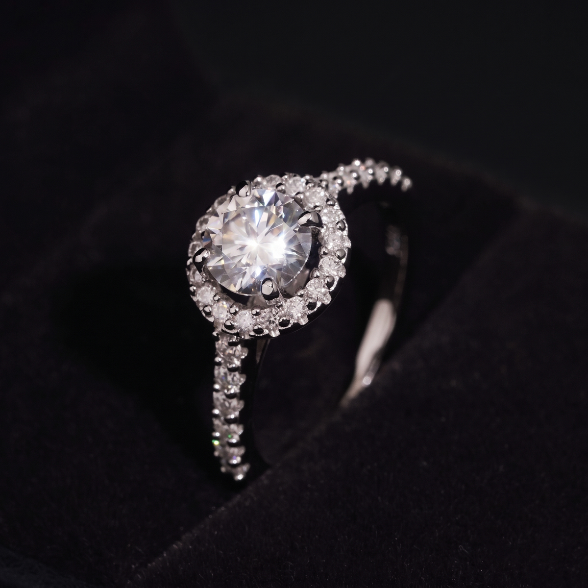 Close up of the 1 carat round brilliant moissanite center stone and halo