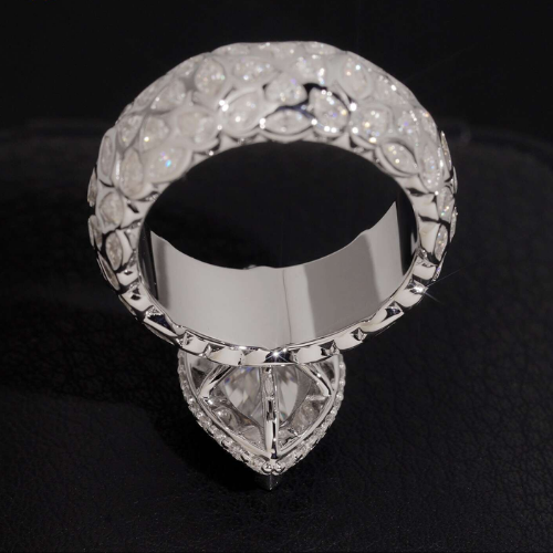 Top down detail of the 925 sterling silver band set with petal shaped stones around the full shank