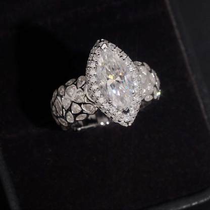 Marquise cut moissanite statement ring in a black gift box, halo prong setting visible