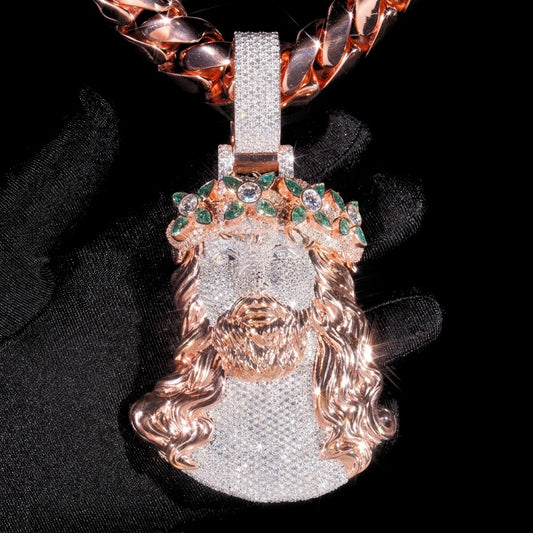 Close detail of 5 inch two tone rose gold moissanite Jesus pendant with green marquise crown