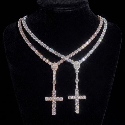 THE ROSARY moissanite cross tennis chain in silver and rose gold on black velvet display bust