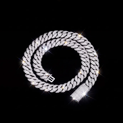 Silver iced out 3 row cuban link chain with fully iced box clasp on black background