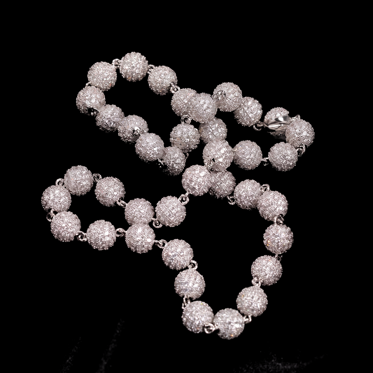Silver rhodium plated 8mm iced out ball chain necklace with simulated diamonds on black