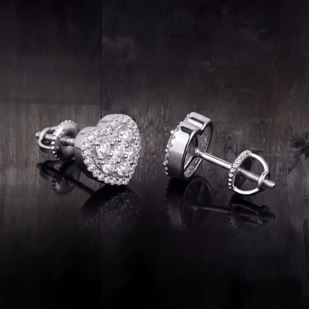 Side profile of the 7.5mm moissanite heart stud showing the polished silver wall