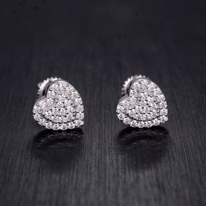 7.5mm moissanite heart stud earrings in 925 sterling silver on dark brushed metal