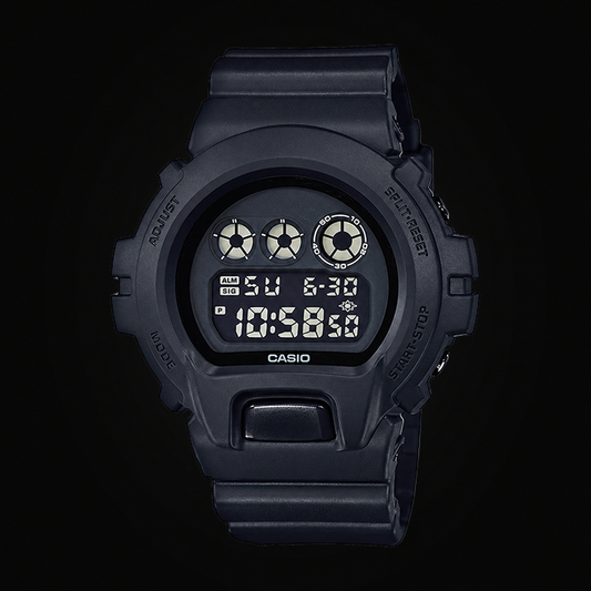 All Black digital watch on dark background; digitally edited plain upper bezel and light button